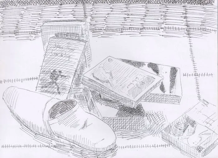 Livres en pagailles et paire de babouches